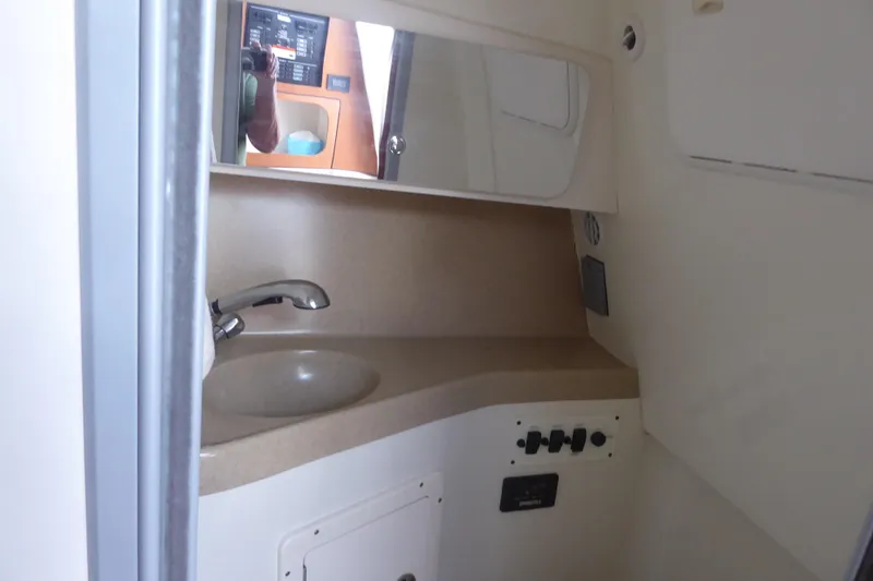 Slide: The Image of 2006 Hydra-Sports Vector 2900 VX cabin bathroom with sink and mirror. - 12
