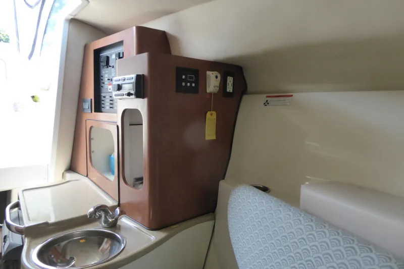 Slide: The Image of 2006 Hydra-Sports Vector 2900 VX cabin interior with sink and control panel. - 15
