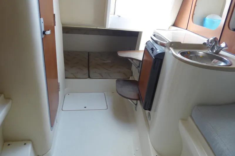 Slide: The Image of 2006 Hydra-Sports Vector 2900 VX cabin interior with sink, seating, and storage. - 17