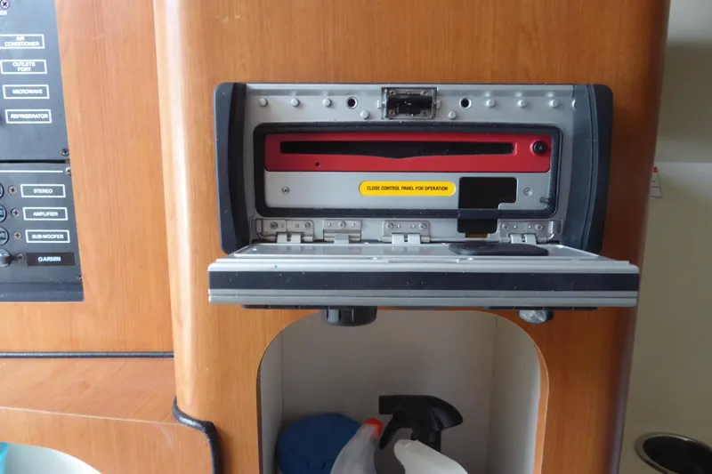 Slide: The Image of 2006 Hydra-Sports Vector 2900 VX control panel with open compartment. - 22