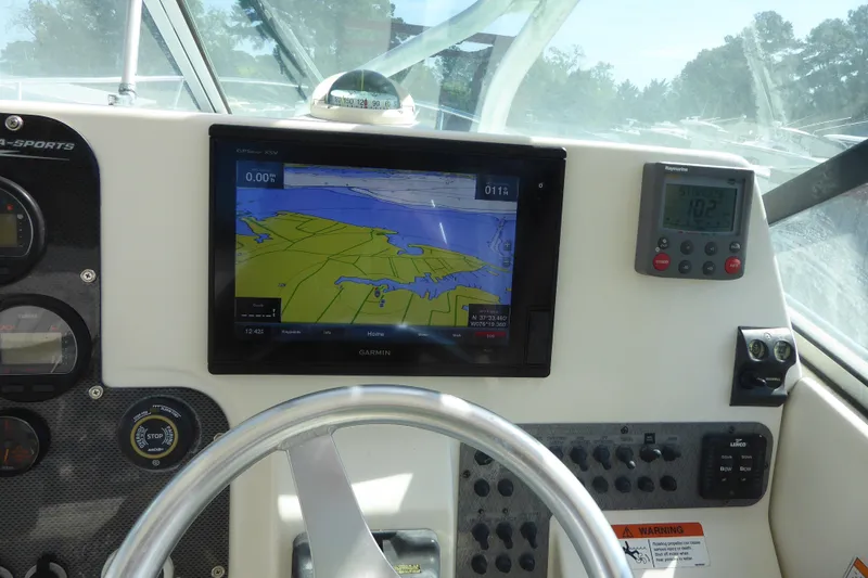Slide: The Image of 2006 Hydra-Sports Vector 2900 VX dashboard with Garmin GPS and navigation controls. - 26