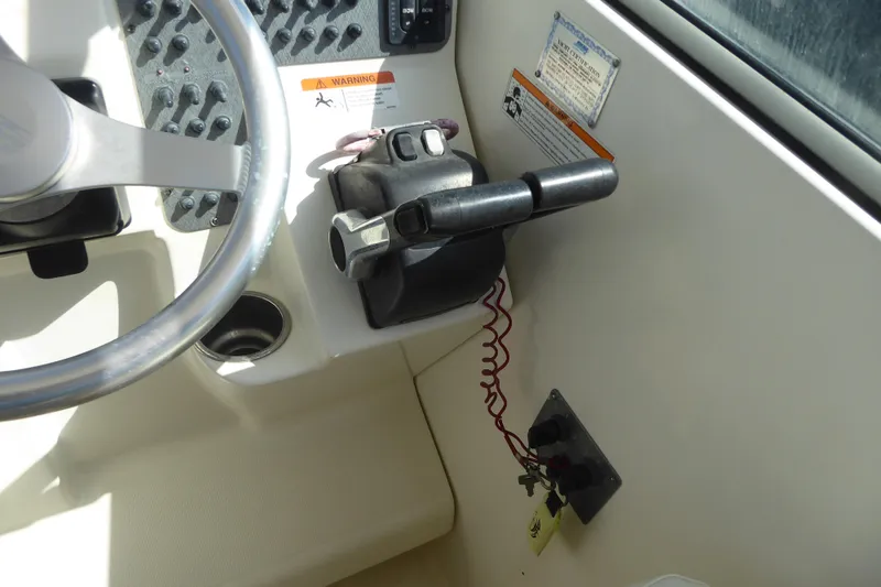 Slide: The Image of 2006 Hydra-Sports Vector 2900 VX boat steering wheel and throttle controls. - 29