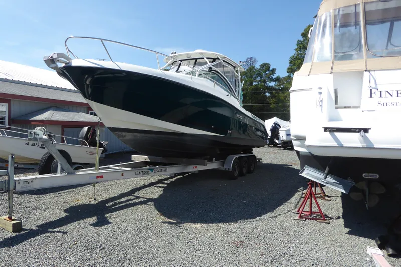 Slide: The Image of 2006 Hydra-Sports Vector 2900 VX boat on trailer, parked outdoors in a marina. - 3