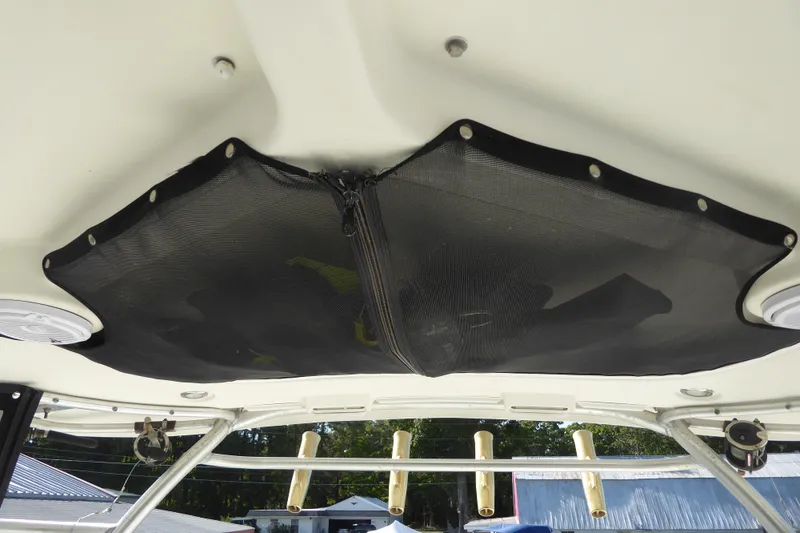 Slide: The Image of 2006 Hydra-Sports Vector 2900 VX boat interior with overhead storage and rod holders. - 32
