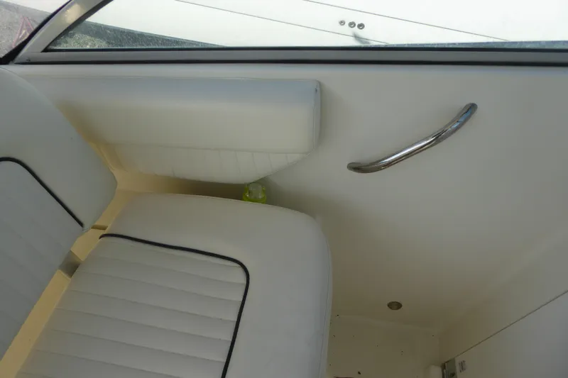 Slide: The Image of 2006 Hydra-Sports Vector 2900 VX interior with white seating and chrome handle. - 34