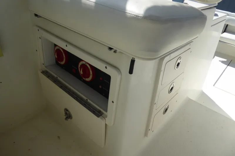 Slide: The Image of 2006 Hydra-Sports Vector 2900 VX boat interior with control panel and storage compartments. - 36