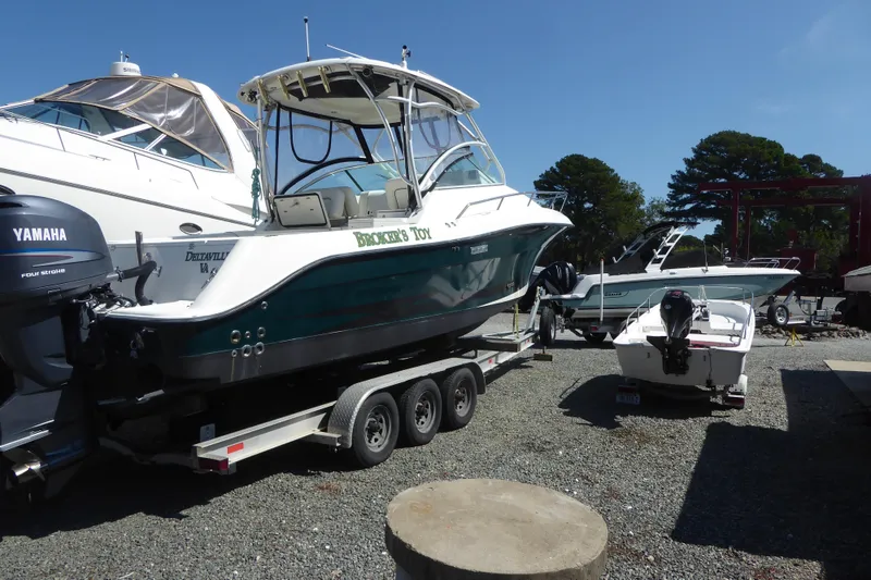 Slide: The Image of 2006 Hydra-Sports Vector 2900 VX boat on trailer, parked beside other boats. - 4