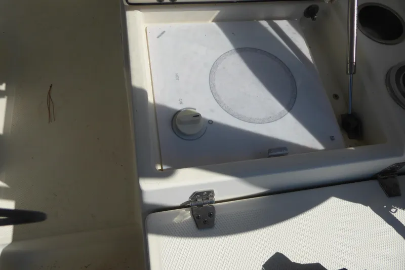 Slide: The Image of 2006 Hydra-Sports Vector 2900 VX boat interior with stove and storage compartment. - 41