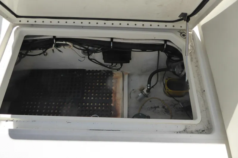 Slide: The Image of Open hatch of a 2006 Hydra-Sports Vector 2900 VX boat, showing internal wiring and components. - 48