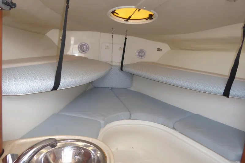 Slide: The Image of 2006 Hydra-Sports Vector 2900 VX cabin interior with cushioned seating and compact sink. - 9