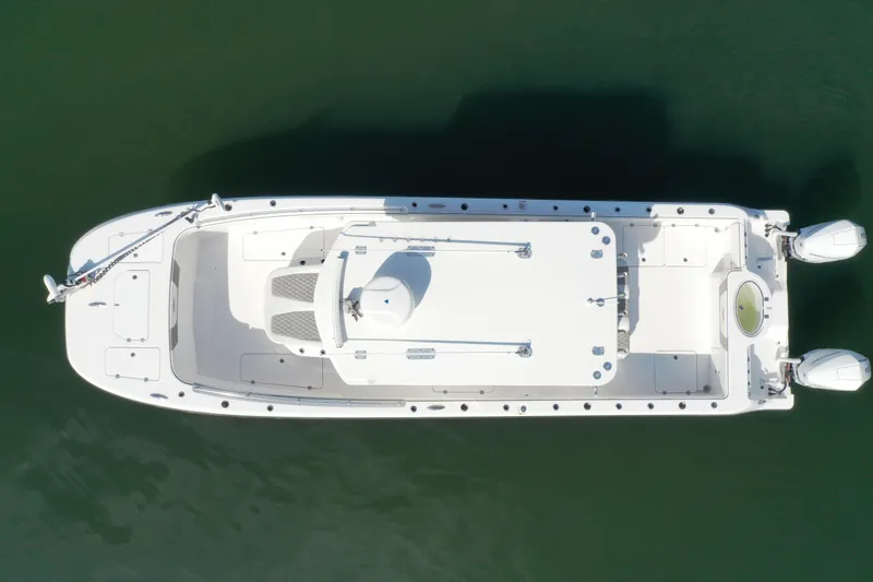 Slide: The Image of Overhead view of 2023 Invincible 33 Catamaran on calm water. - 1