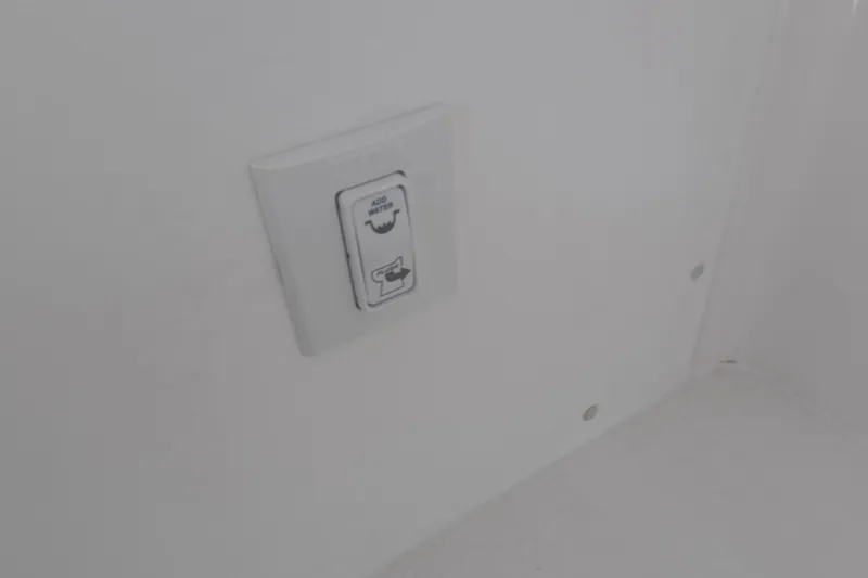 Slide: The Image of Switch panel on 2023 Invincible 33 Catamaran interior, labeled "Add Water." - 17