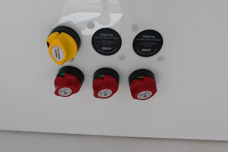 Slide: The Image of Control panel of 2023 Invincible 33 Catamaran with digital voltage relays and switches. - 40