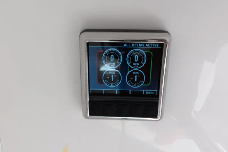 Slide: The Image of Digital display panel on 2023 Invincible 33 Catamaran, showing helm activity and rudder settings. - 6