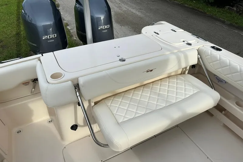 Slide: The Image of 2011 Grady-White Freedom 275 boat with Yamaha 200 engines and cushioned seating. - 11