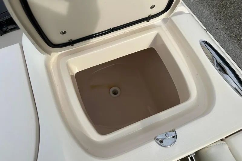 Slide: The Image of Open storage compartment on 2011 Grady-White Freedom 275 boat. - 14