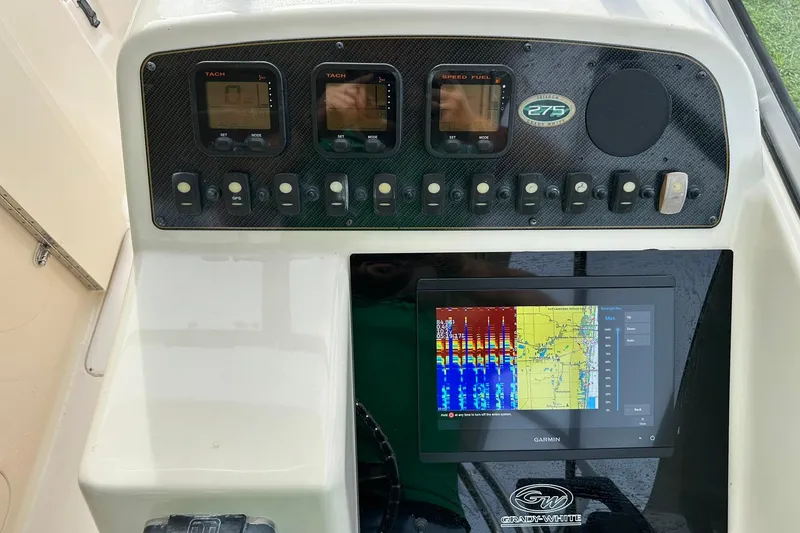 Slide: The Image of Grady-White Freedom 275 dashboard with Garmin display, 2011 model. - 20