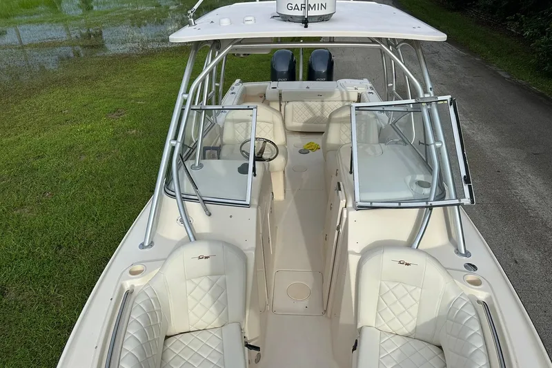 Slide: The Image of 2011 Grady-White Freedom 275 boat with dual engines and spacious seating. - 25