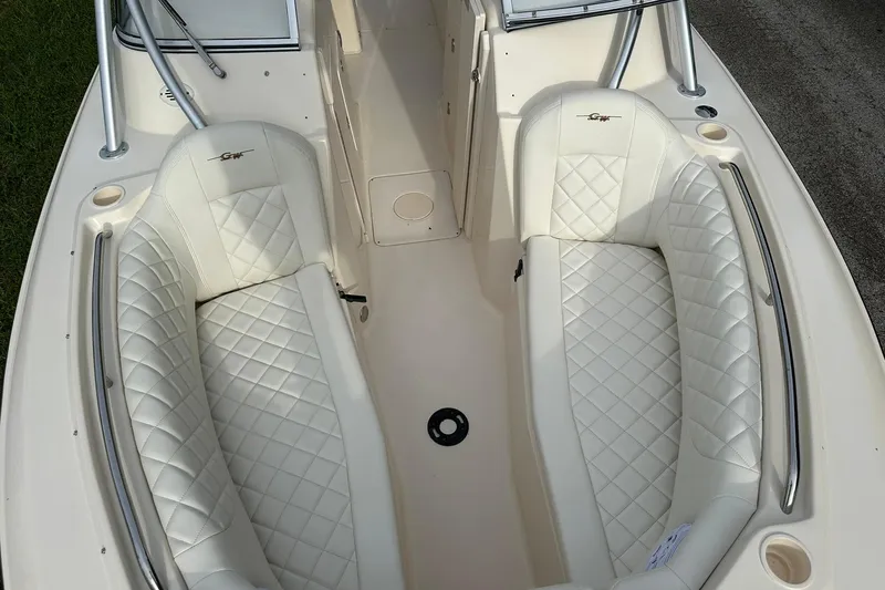Slide: The Image of 2011 Grady-White Freedom 275 boat interior with white quilted seating. - 26