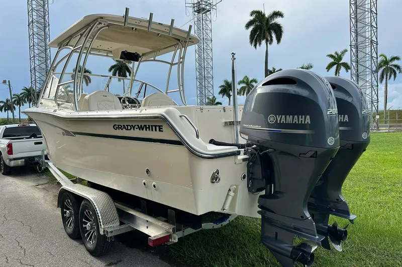 Slide: The Image of 2011 Grady-White Freedom 275 boat with twin Yamaha 200 engines on a trailer. - 5
