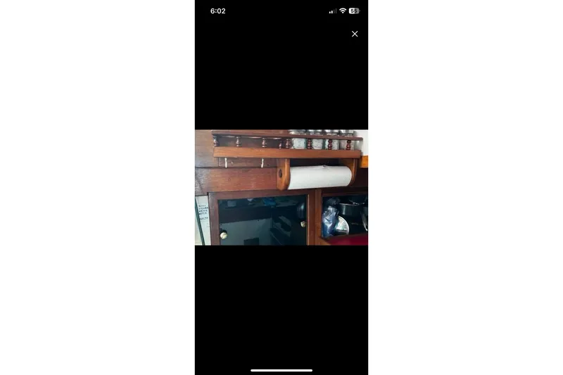Slide: The Image of Interior of 1975 Dreadnought 32 Ketch with spice rack and paper towel holder. - 33