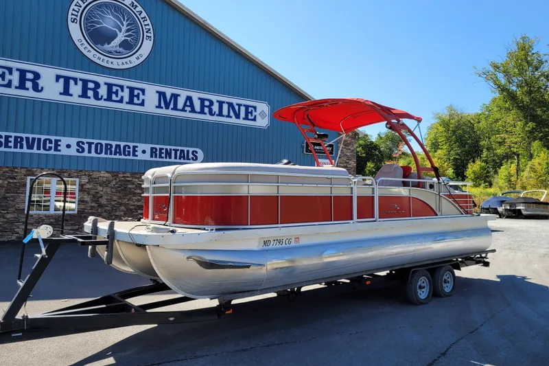 Slide: The Image of 2014 Bennington G23 pontoon boat with red canopy at Silver Tree Marine. - 12