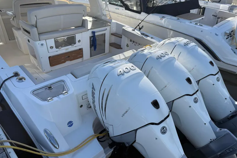 Slide: The Image of 2020 Boston Whaler 350 Realm with triple 400 horsepower engines, luxurious seating, and modern amenities. - 1