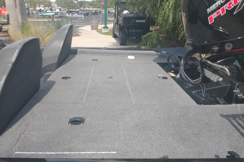 Slide: The Image of 2023 Tracker Pro Team 190 TX boat with spacious deck and powerful engine. - 6