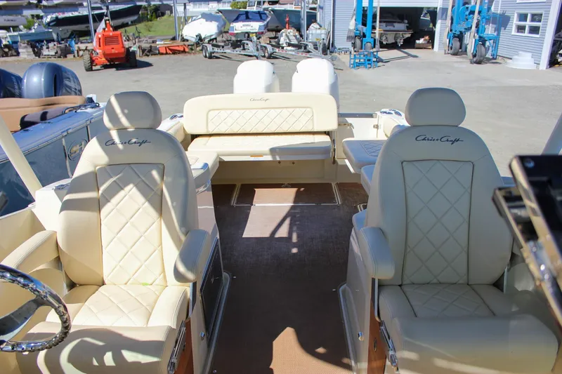 Slide: The Image of 2017 Chris-Craft Calypso 26 boat interior with cream leather seating and elegant design. - 27
