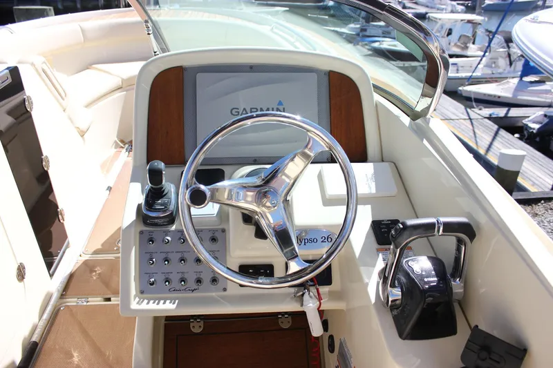 Slide: The Image of 2017 Chris-Craft Calypso 26 helm with Garmin display and controls. - 28