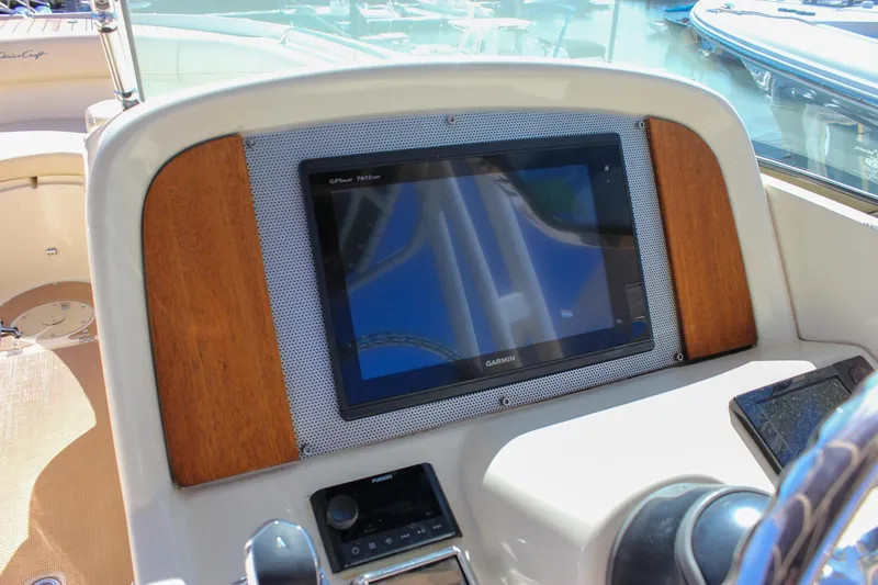Slide: The Image of 2017 Chris-Craft Calypso 26 dashboard with Garmin GPS display. - 33
