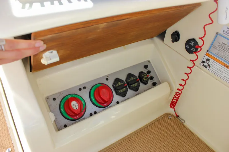 Slide: The Image of 2017 Chris-Craft Calypso 26 boat battery switches and control panel. - 36