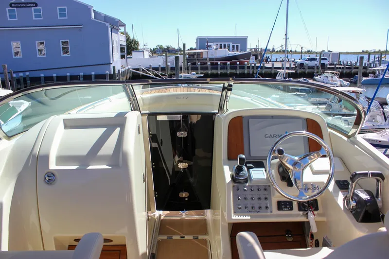 Slide: The Image of 2017 Chris-Craft Calypso 26 helm with Garmin navigation, docked at Harborside Marina. - 43