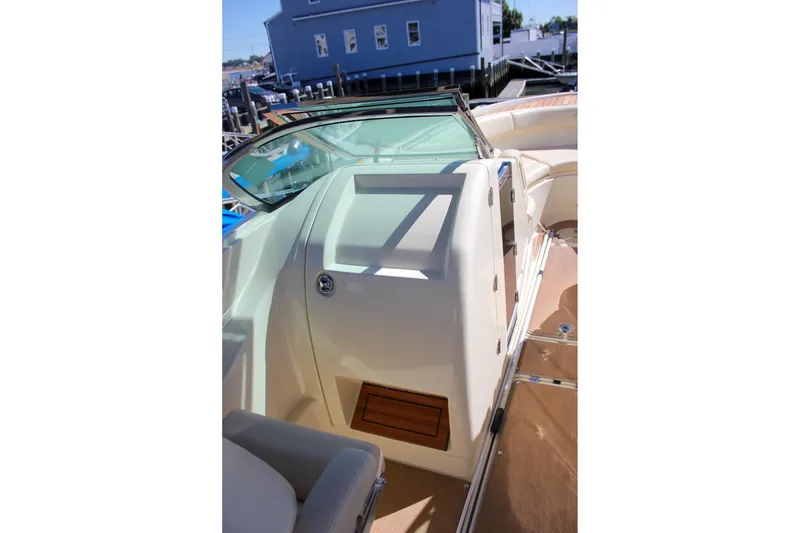 Slide: The Image of 2017 Chris-Craft Calypso 26 boat interior with beige seating and sleek design. - 45