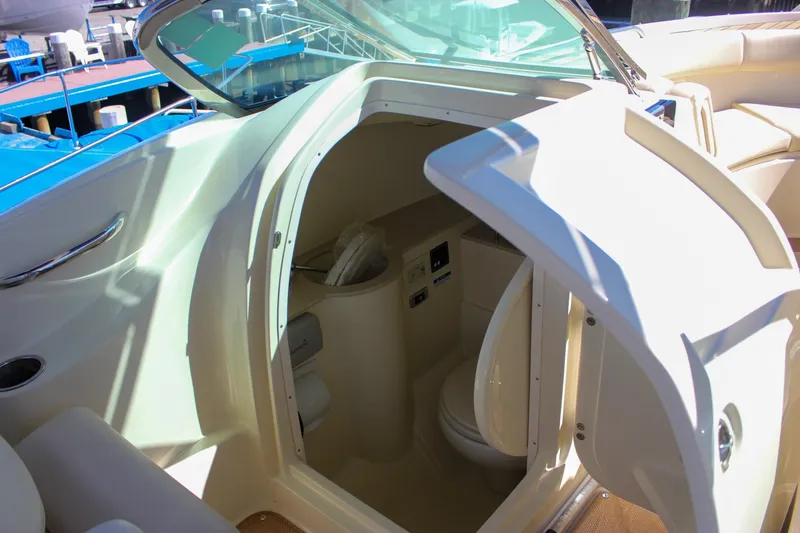 Slide: The Image of 2017 Chris-Craft Calypso 26 boat interior with open cabin door and seating area. - 46