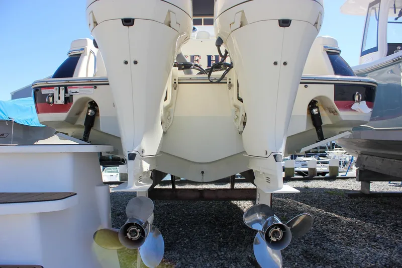 Slide: The Image of 2017 Chris-Craft Calypso 26 boat with dual outboard engines, rear view. - 6