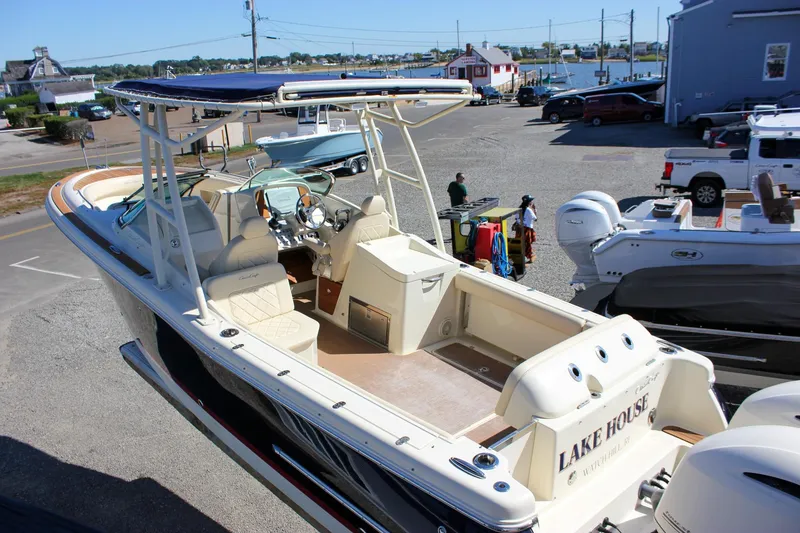 Slide: The Image of 2017 Chris-Craft Calypso 26 boat docked, featuring spacious seating and elegant design. - 60