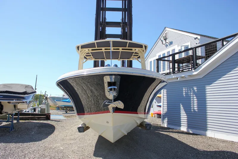 Slide: The Image of 2017 Chris-Craft Calypso 26 boat on display at a marina. - 65
