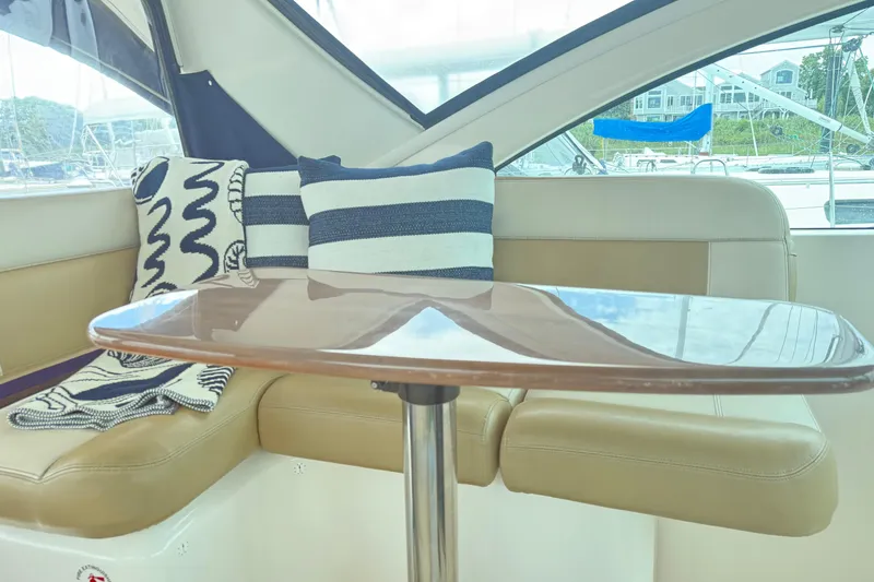 Slide: The Image of Interior of 2012 Tiara Yachts 3100 Coronet with cozy seating and nautical decor. - 17
