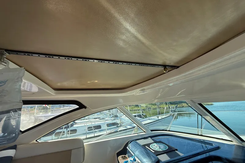 Slide: The Image of Interior view of 2012 Tiara Yachts 3100 Coronet, showcasing windows and ceiling design. - 18