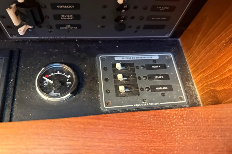 Slide: The Image of Control panel of a 2012 Tiara Yachts 3100 Coronet with gauges and switches. - 28