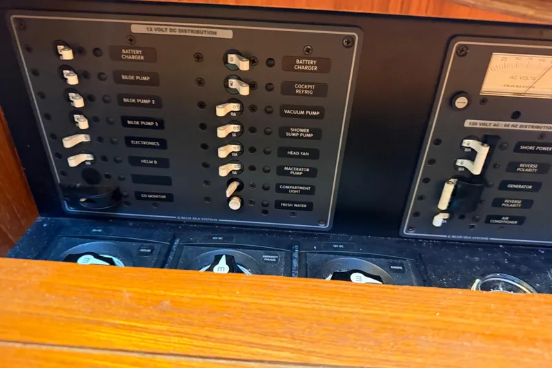 Slide: The Image of Control panel of a 2012 Tiara Yachts 3100 Coronet with various switches and gauges. - 29