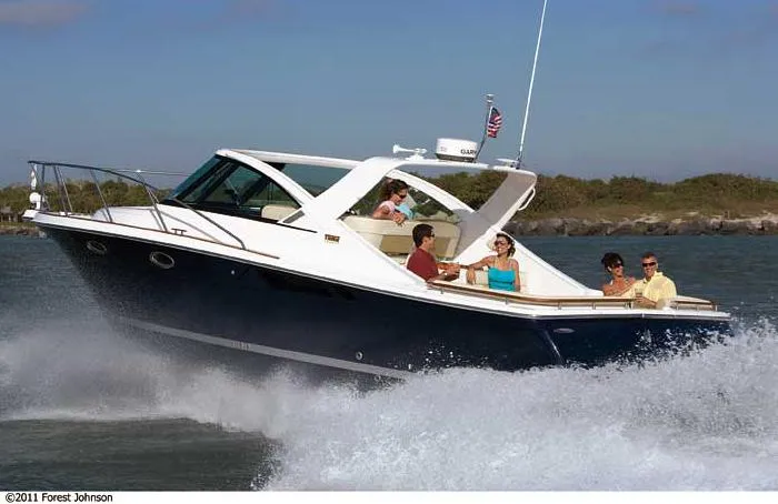 Slide: The Image of Manufacturer Provided Image: 2012 Tiara Yachts 3100 Coronet cruising with passengers on a sunny day. - 3