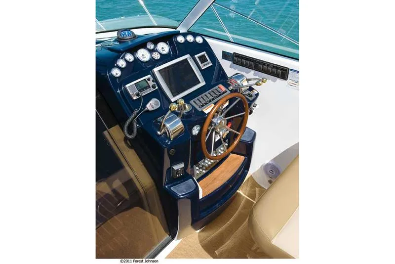 Slide: The Image of Manufacturer Provided Image: 2012 Tiara Yachts 3100 Coronet helm with navigation instruments and steering wheel. - 4