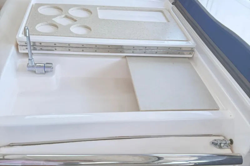 Slide: The Image of 2012 Tiara Yachts 3100 Coronet sink and countertop detail with faucet and cup holders. - 40