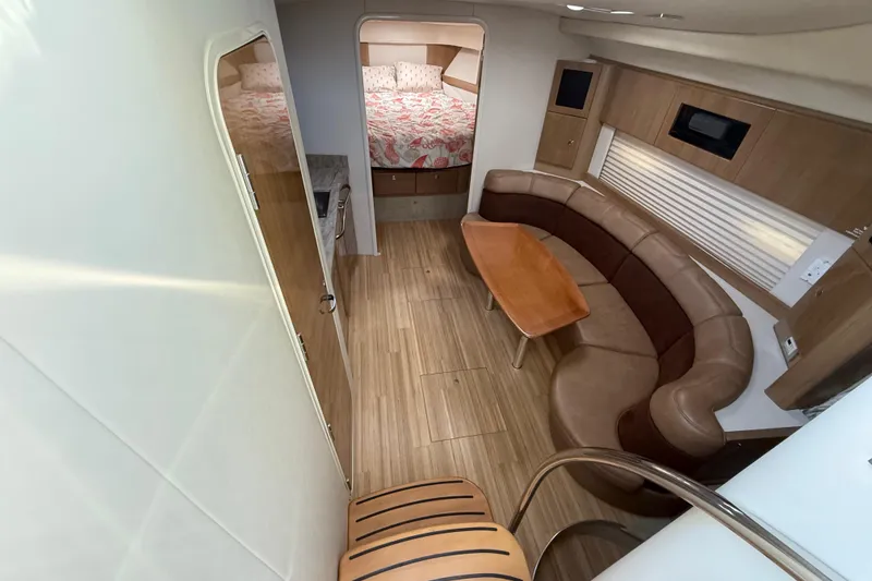 Slide: The Image of Interior of 2016 Formula 37 Performance Cruiser with seating, table, and bed. - 21
