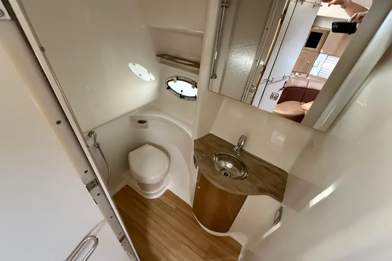 Slide: The Image of 2016 Formula 37 Performance Cruiser bathroom with sink, toilet, and mirror. - 24