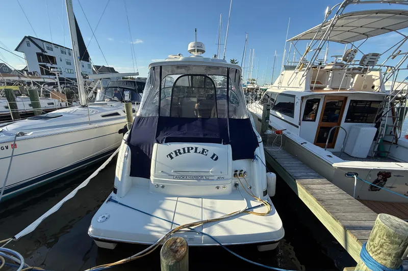 Slide: The Image of 2016 Formula 37 Performance Cruiser docked at marina, surrounded by other boats. - 5