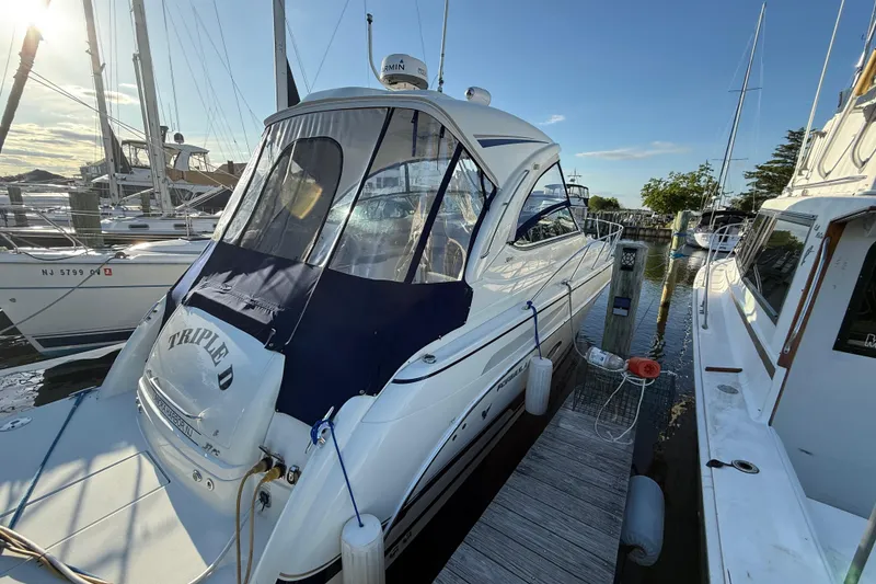 Slide: The Image of 2016 Formula 37 Performance Cruiser docked at marina, sunny day. - 6