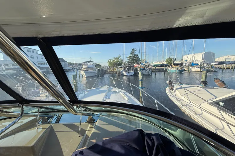 Slide: The Image of 2016 Formula 37 Performance Cruiser docked at marina, surrounded by sailboats and clear blue sky. - 7
